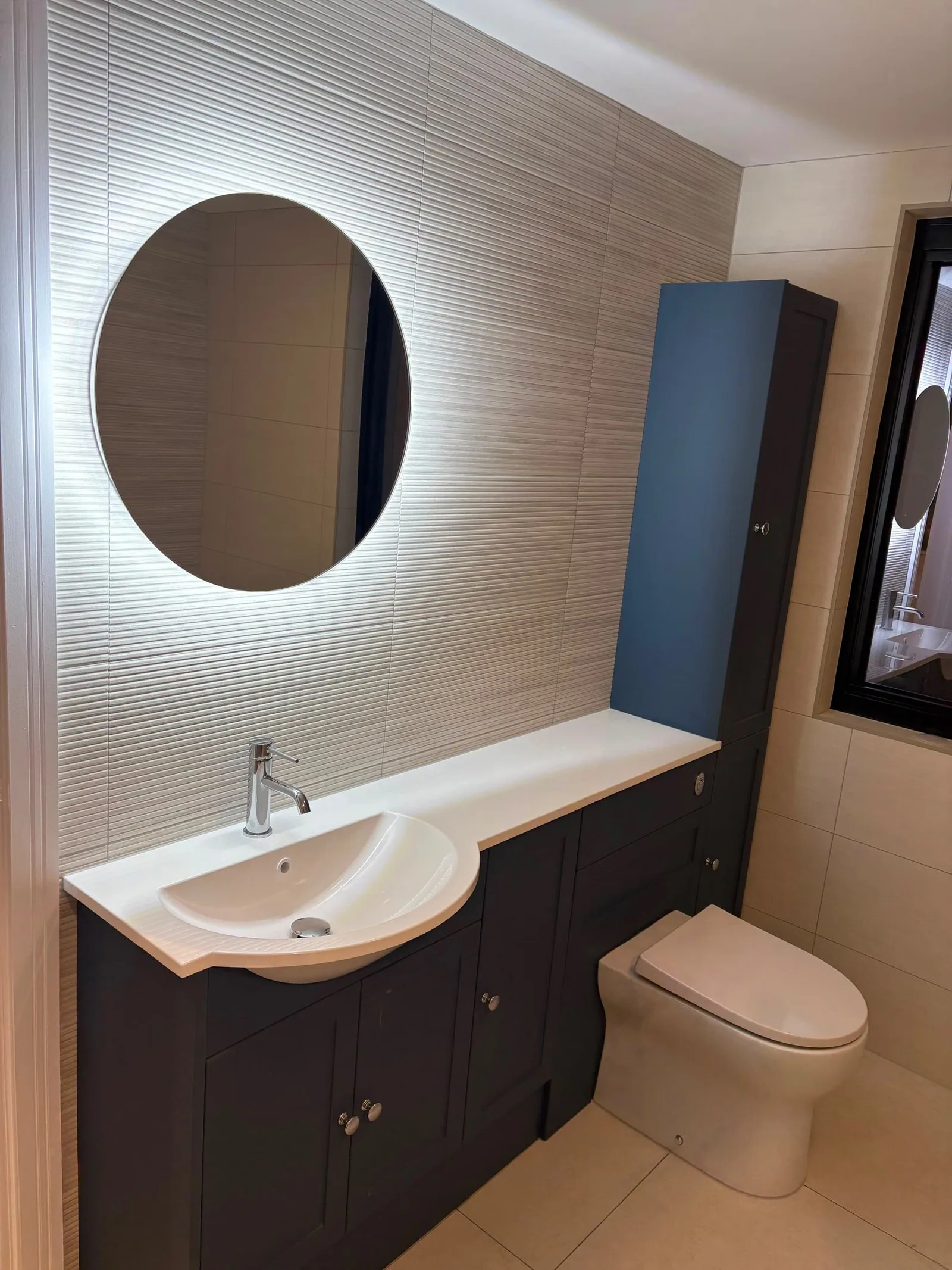 Bathroom vanity and illuminated mirror